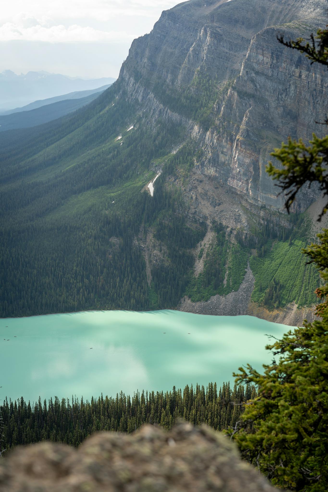 Breathtaking view of turquoise lake and rugged mountains in Banff National Park, Canada.